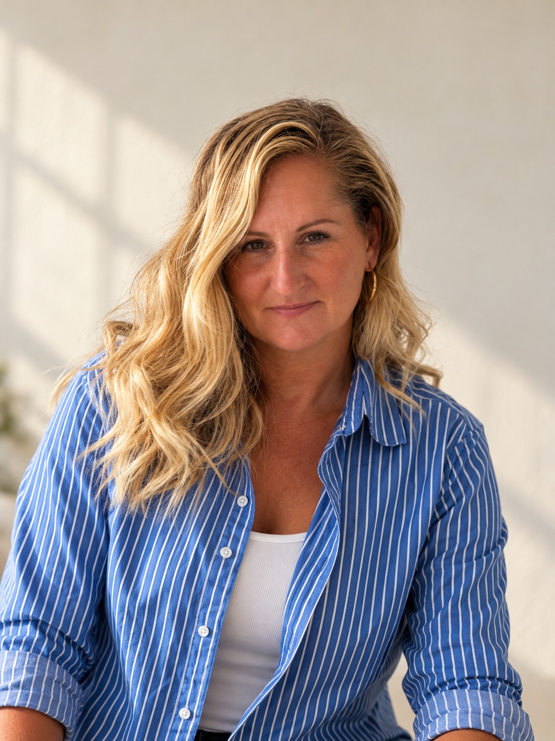 Trish Calhoun in a blue striped shirt